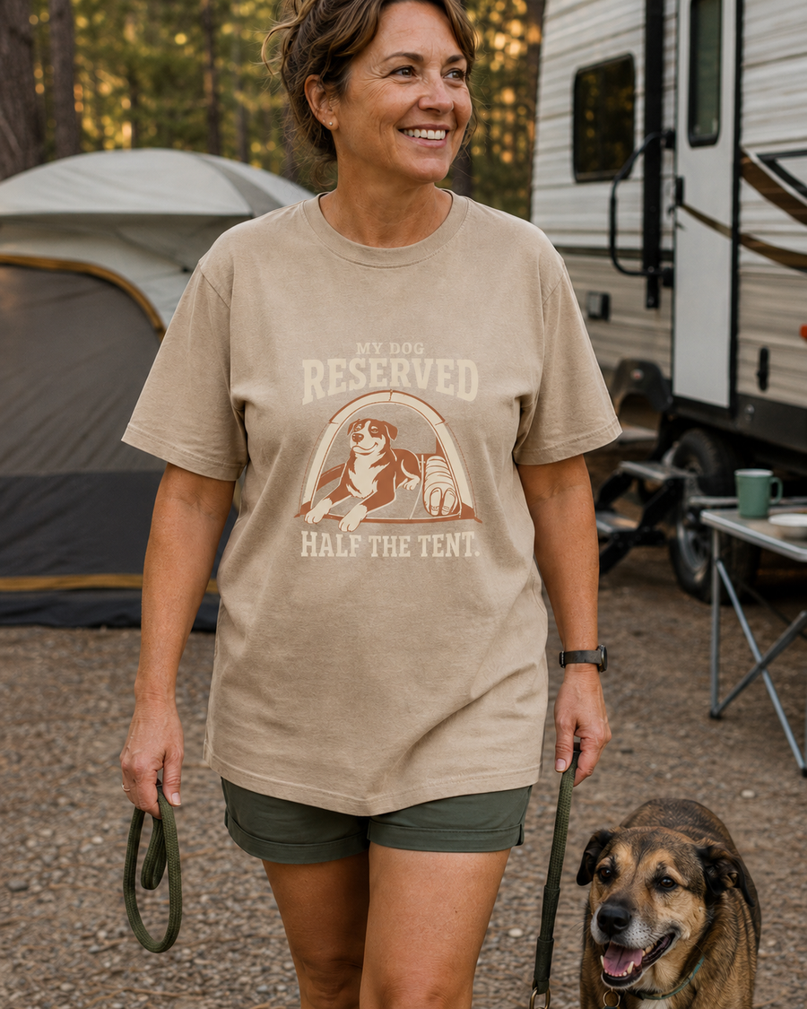 Camper and dog at a tent, both in Questionable Outdoors gear
