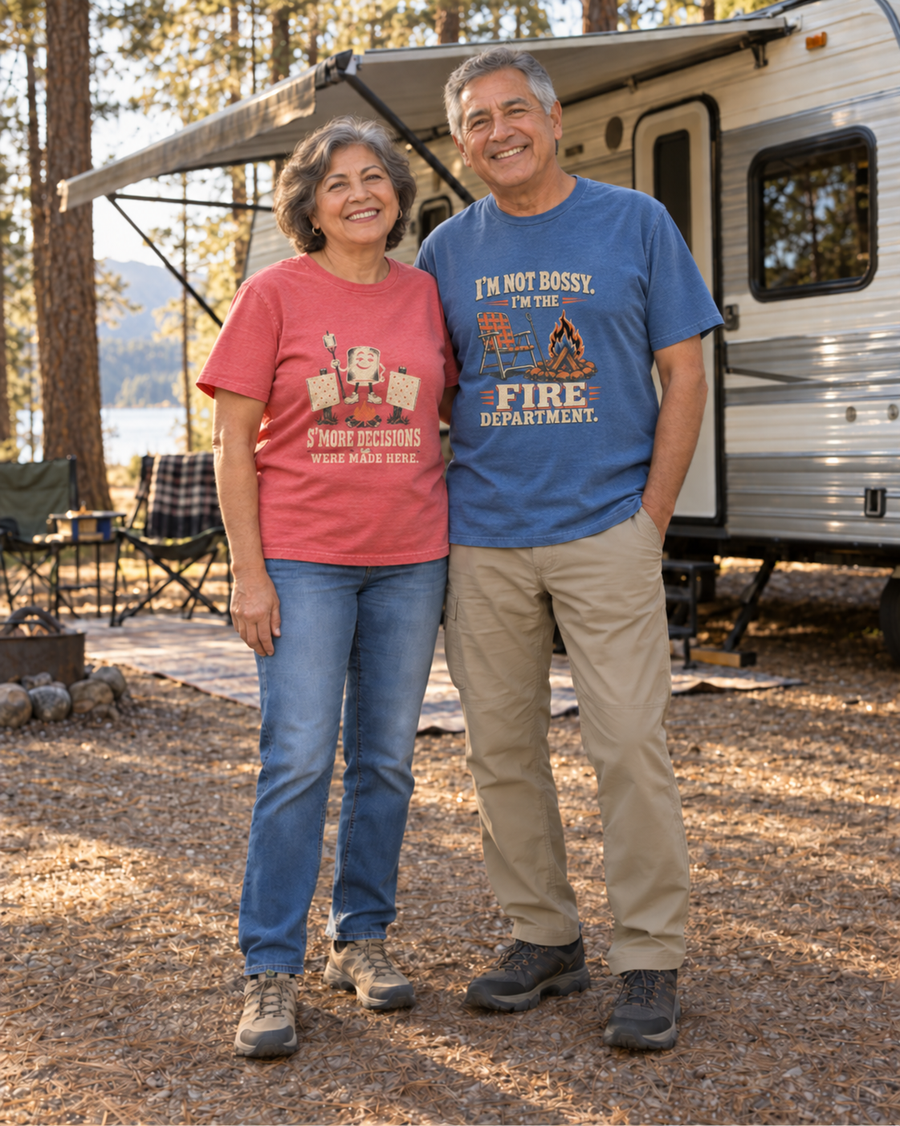 Campers wearing the ‘Built the Fire, Lost the Tongs, Found the Beer’ tee by a campfire