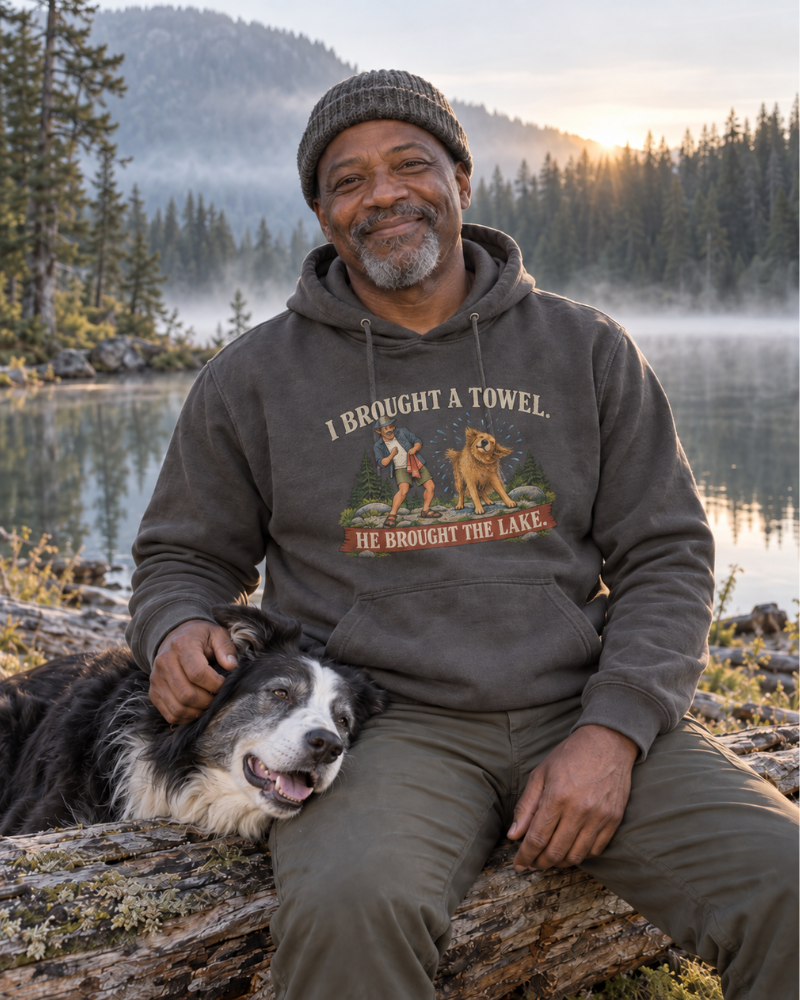 Campers wearing the ‘Built the Fire, Lost the Tongs, Found the Beer’ tee by a campfire